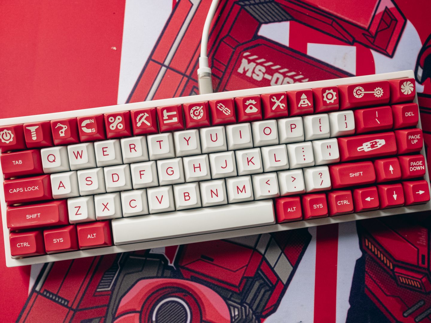 Aesthetic top view of a custom mechanical keyboard with unique red and white keycaps.